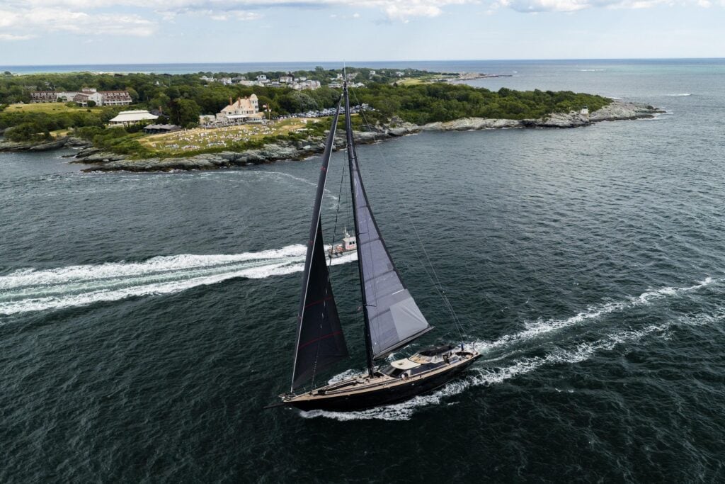 Aerial view of a classic sloop under sail off the Rhode Island coast