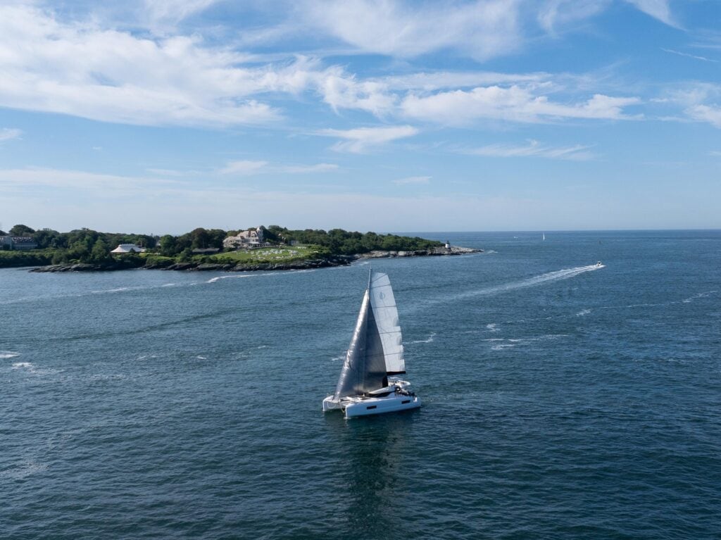 Lagoon 43 catamaran under sail along the Newport coastline