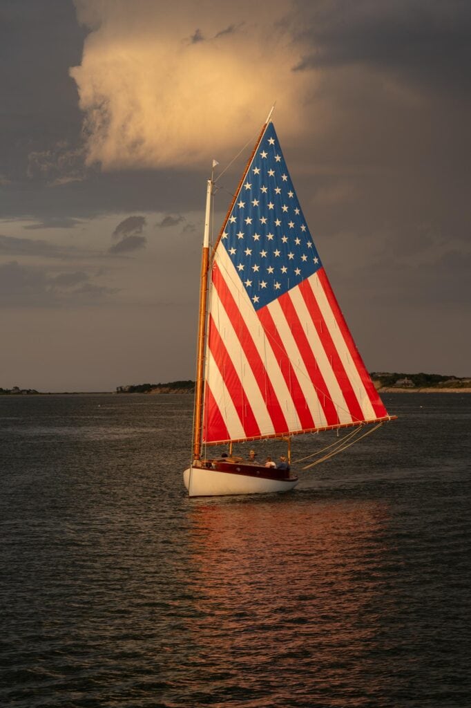 Classic sailing boat flying a large United States ensign, Martha's Vineyard