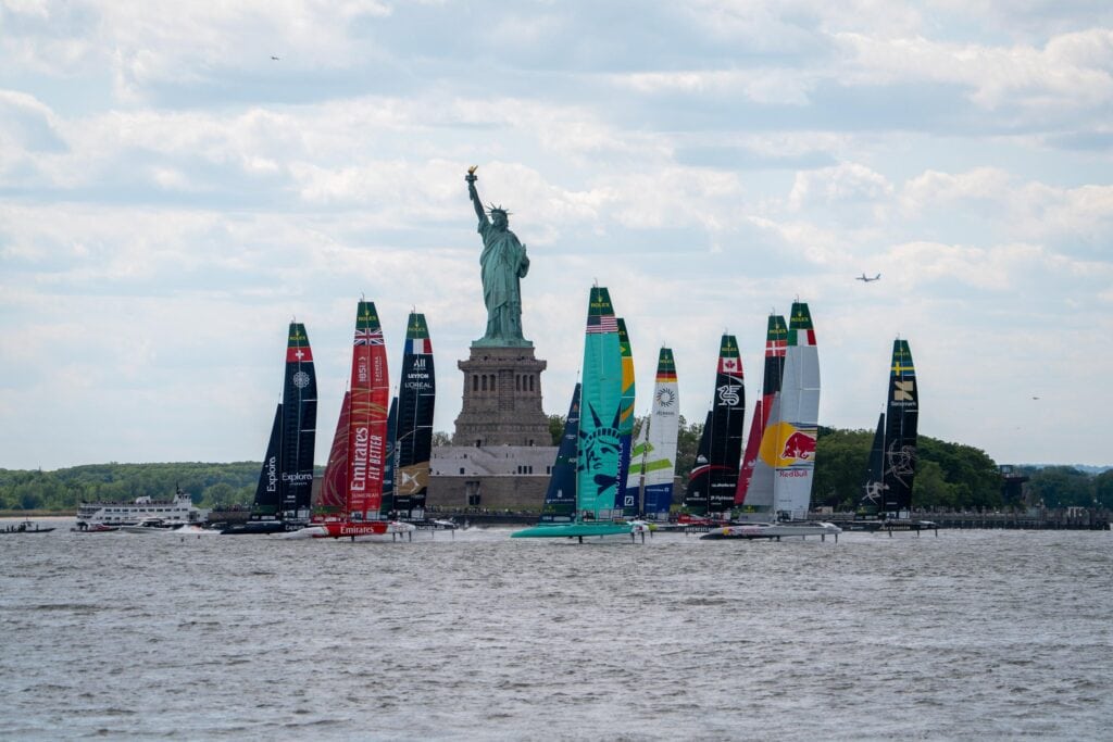 SailGP F50 fleet lined up off the Statue of Liberty, New York