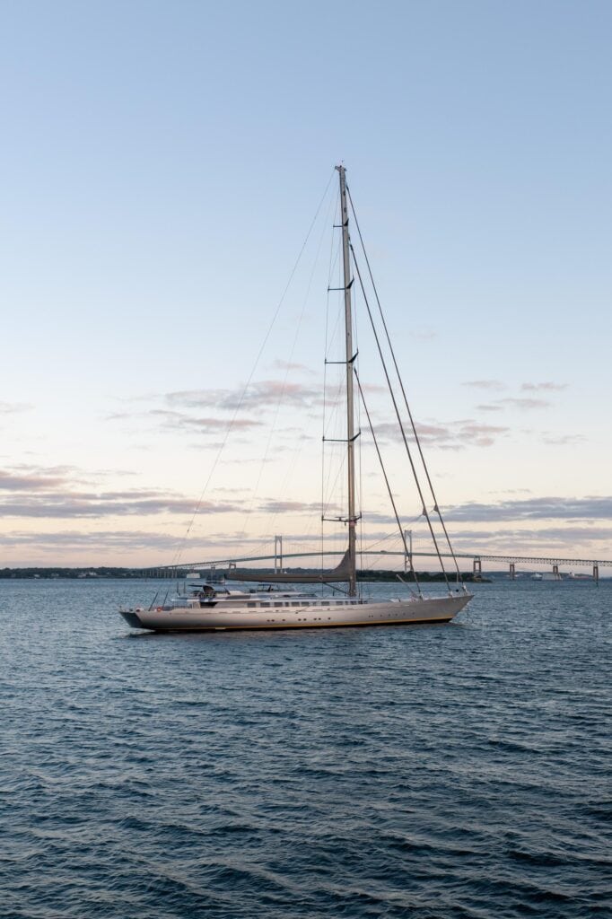Classic sailing yacht at anchor at dusk off Newport, Rhode Island