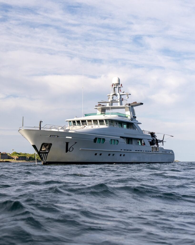 Explorer motor yacht with tender crane under way off Newport