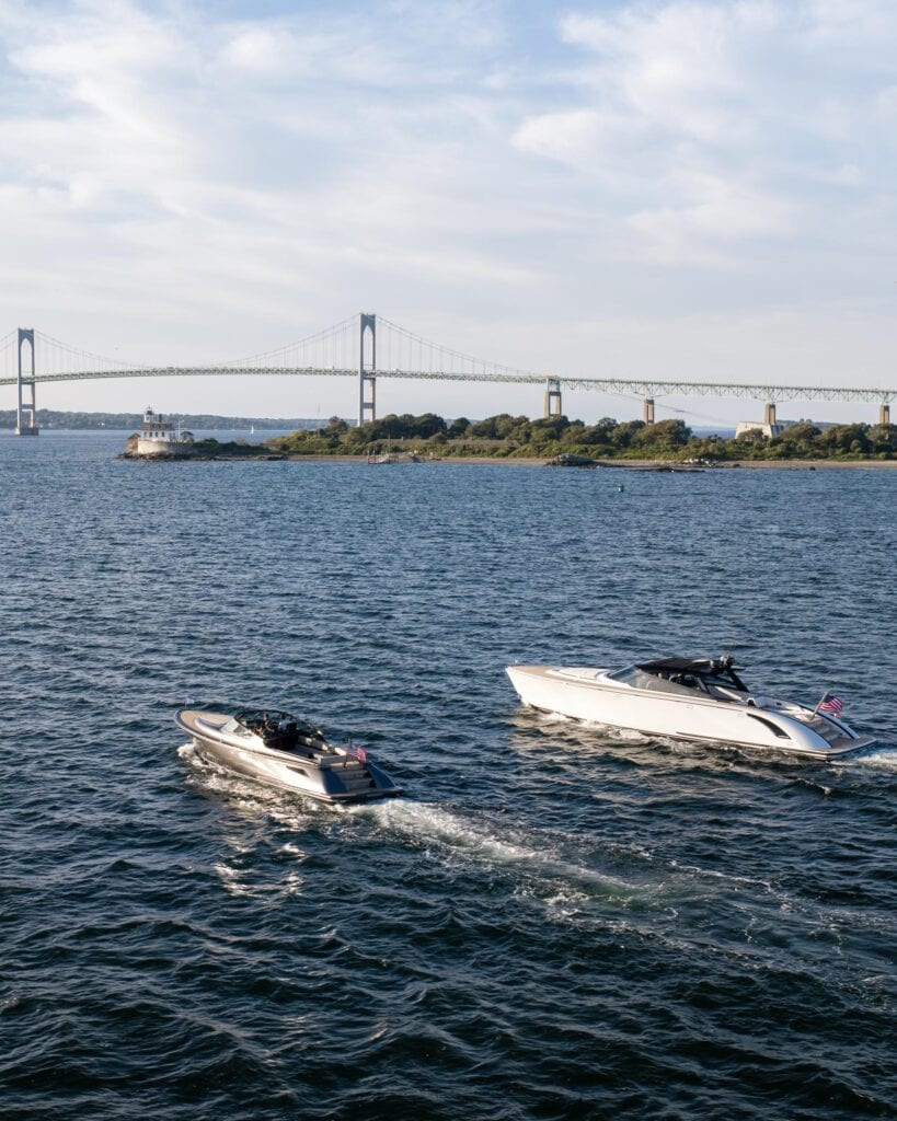 Wajer dayboats running side by side beneath the Newport Bridge
